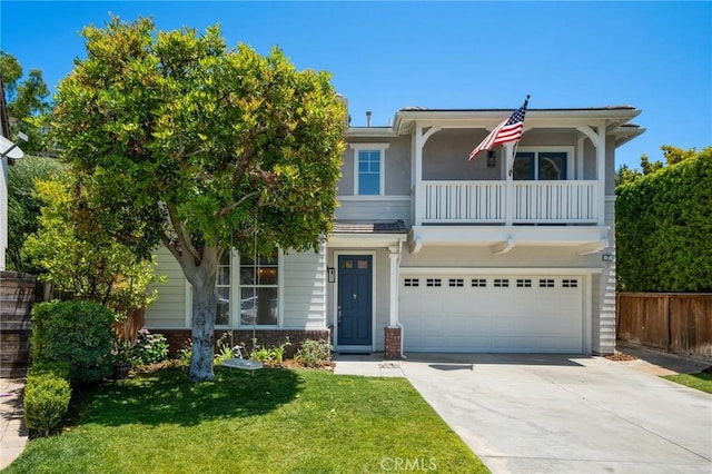 7 Gatewood Dr, Aliso Viejo, CA 92656 - view of front of property featuring a balcony, concrete driveway, and an attached garage