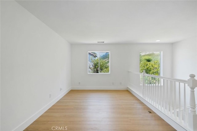 7 Gatewood Dr, Aliso Viejo, CA 92656 - empty room with healthy amount of natural light and light wood-style flooring