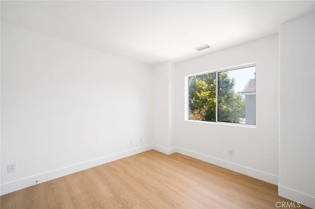 7 Gatewood Dr, Aliso Viejo, CA 92656 - spare room featuring baseboards and light wood-type flooring