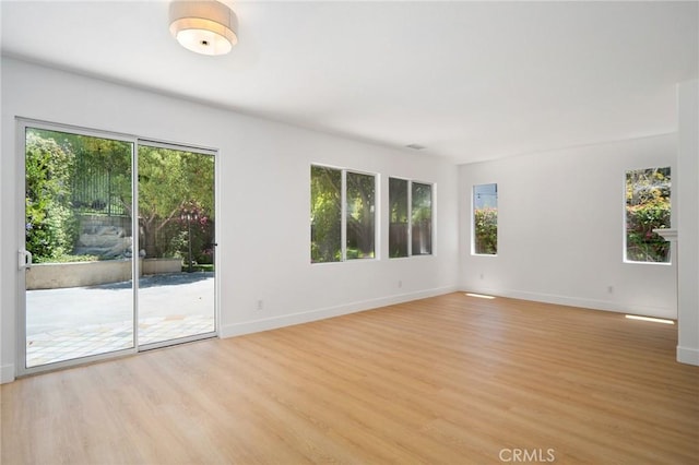 7 Gatewood Dr, Aliso Viejo, CA 92656 - spare room with healthy amount of natural light and light wood finished floors