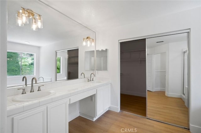 7 Gatewood Dr, Aliso Viejo, CA 92656 - full bathroom featuring wood finished floors, double vanity, and a spacious closet