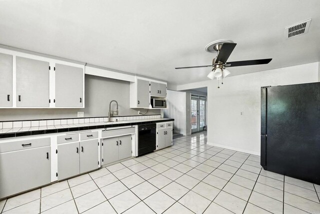 10150 Sierra Madre Rd, Spring Valley, CA 91977 - kitchen with black appliances, a ceiling fan, tile counters, light tile patterned floors, and white cabinetry