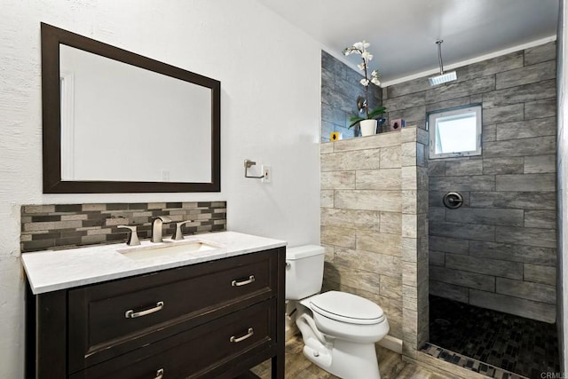 10150 Sierra Madre Rd, Spring Valley, CA 91977 - bathroom featuring vanity, a walk in shower, backsplash, and wood finished floors