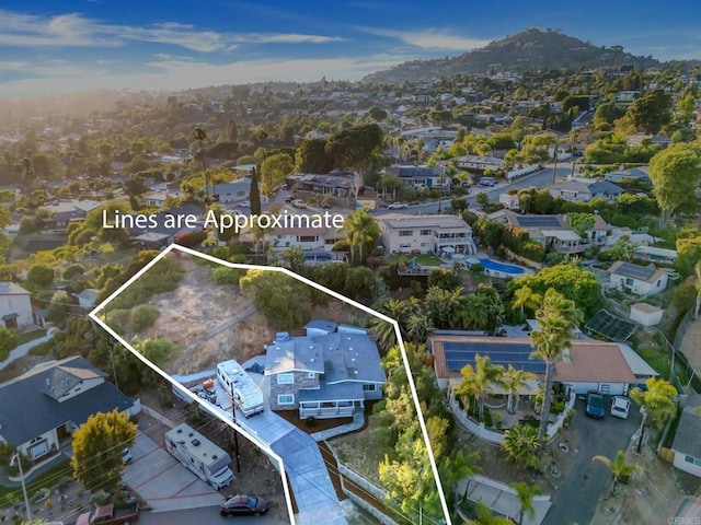 10150 Sierra Madre Rd, Spring Valley, CA 91977 - aerial view of residential area featuring property parcel outlined and mountains