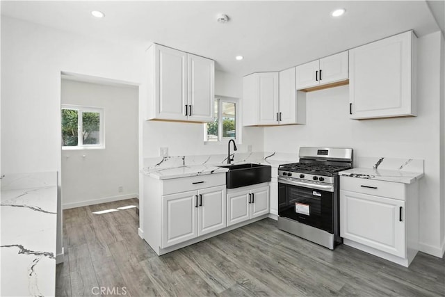 13886 Paxton St, Pacoima, CA 91331 - kitchen with gas range, healthy amount of natural light, light stone counters, and recessed lighting