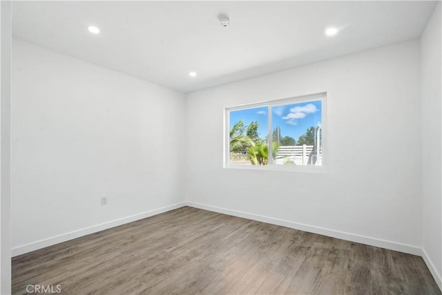 13886 Paxton St, Pacoima, CA 91331 - unfurnished room featuring wood finished floors, recessed lighting, and a smoke detector