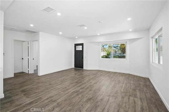 13886 Paxton St, Pacoima, CA 91331 - empty room with dark wood-type flooring and recessed lighting