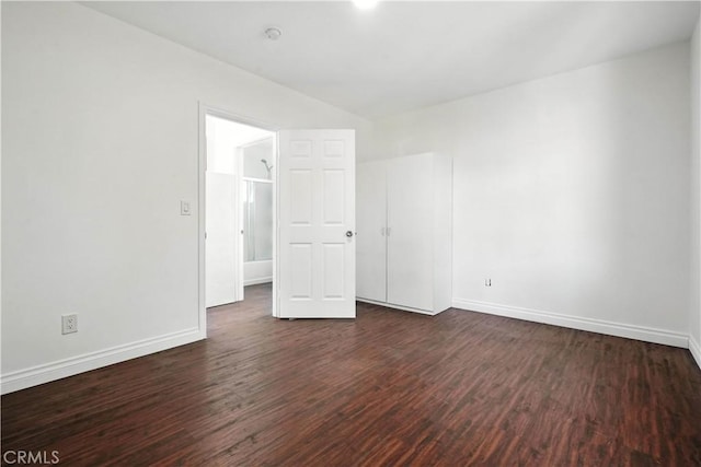 13886 Paxton St, Pacoima, CA 91331 - unfurnished room featuring dark wood-style flooring and baseboards