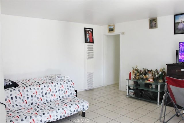 10343 Amherst Ave, Montclair, CA 91763 - bedroom with light tile patterned floors and a heating unit