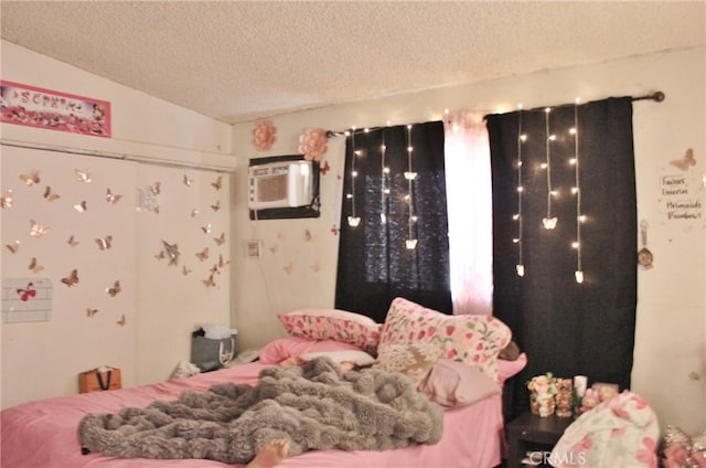 10343 Amherst Ave, Montclair, CA 91763 - bedroom featuring an AC wall unit and a textured ceiling