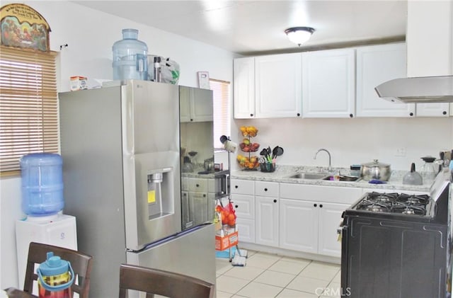 10343 Amherst Ave, Montclair, CA 91763 - kitchen featuring ventilation hood, stainless steel fridge, black gas range, light countertops, and light tile patterned floors