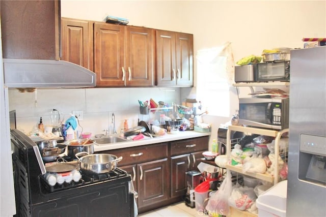 10343 Amherst Ave, Montclair, CA 91763 - kitchen featuring appliances with stainless steel finishes, range hood, decorative backsplash, light countertops, and light tile patterned floors