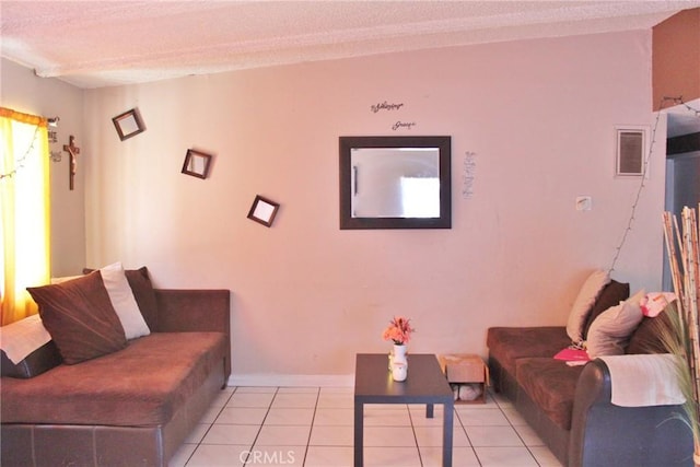 10343 Amherst Ave, Montclair, CA 91763 - living area featuring a textured ceiling and light tile patterned floors