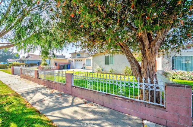 3232 W 187th St, Torrance, CA 90504 - view of front facade featuring a fenced front yard, stucco siding, and a garage