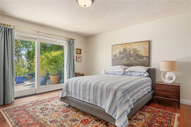 17248 Barneston Ct, Granada Hills, CA 91344 - bedroom featuring access to outside, wood finished floors, and a textured ceiling