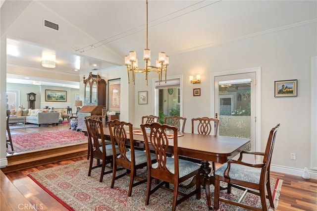 17248 Barneston Ct, Granada Hills, CA 91344 - dining room featuring wood finished floors, ornamental molding, and a chandelier