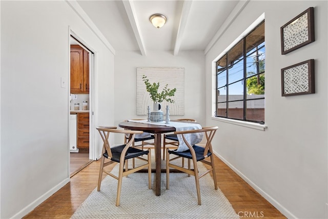 14819 San Feliciano Dr, La Mirada, CA 90638 - dining space featuring light wood-style floors and beamed ceiling