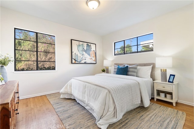 14819 San Feliciano Dr, La Mirada, CA 90638 - bedroom with baseboards and wood finished floors