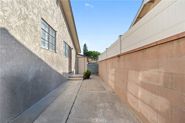 14819 San Feliciano Dr, La Mirada, CA 90638 - view of side of property featuring stucco siding and a patio