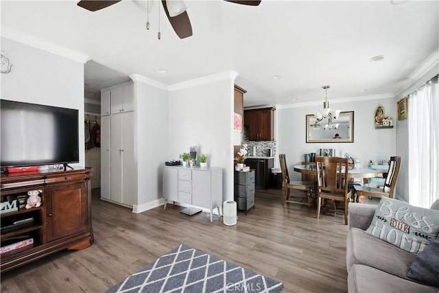 13643 Alcade St, La Puente, CA 91746 - living room featuring a ceiling fan, a chandelier, crown molding, light wood-type flooring, and recessed lighting