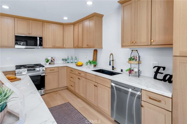 5621 E Carita St, Long Beach, CA 90808 - kitchen featuring appliances with stainless steel finishes, light brown cabinetry, recessed lighting, and light stone counters