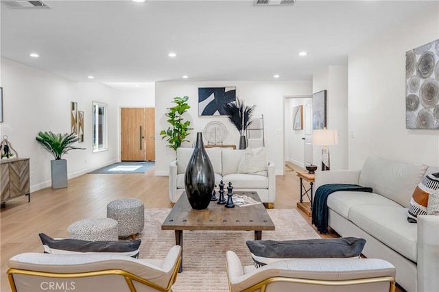 5621 E Carita St, Long Beach, CA 90808 - living room featuring light wood-style flooring and recessed lighting