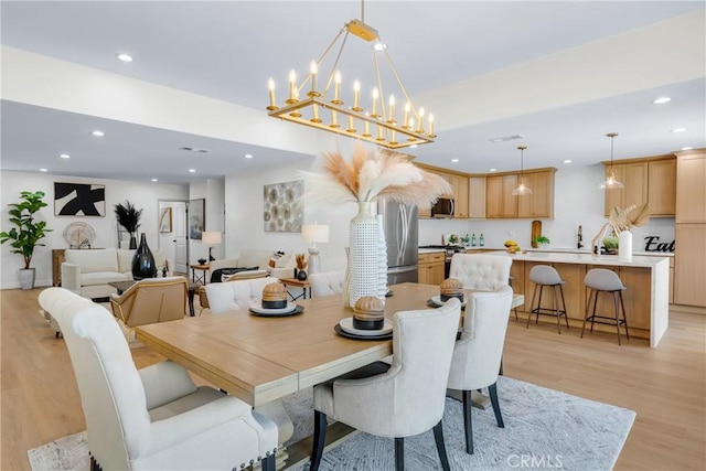 5621 E Carita St, Long Beach, CA 90808 - dining room featuring light wood-style floors, recessed lighting, and a chandelier