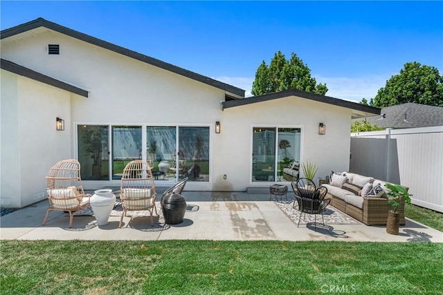 5621 E Carita St, Long Beach, CA 90808 - rear view of house featuring an outdoor hangout area, stucco siding, and a patio