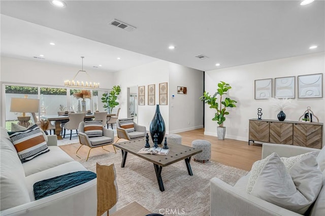 5621 E Carita St, Long Beach, CA 90808 - living room with a chandelier, light wood finished floors, and recessed lighting