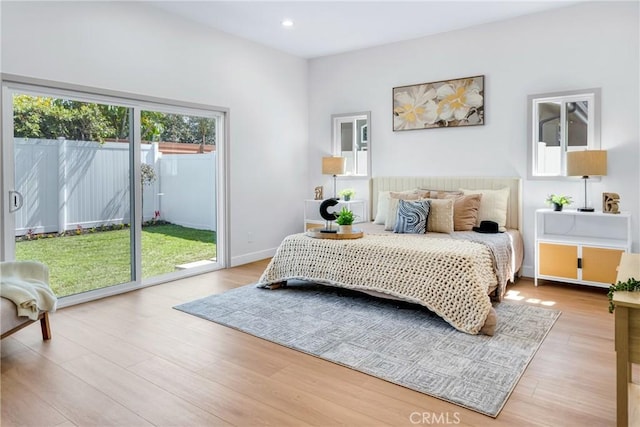 5621 E Carita St, Long Beach, CA 90808 - bedroom with access to outside, light wood finished floors, and recessed lighting