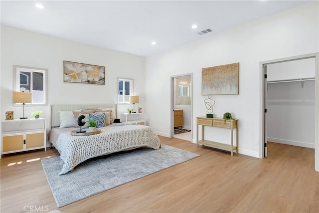 5621 E Carita St, Long Beach, CA 90808 - bedroom with light wood finished floors, a spacious closet, recessed lighting, and connected bathroom