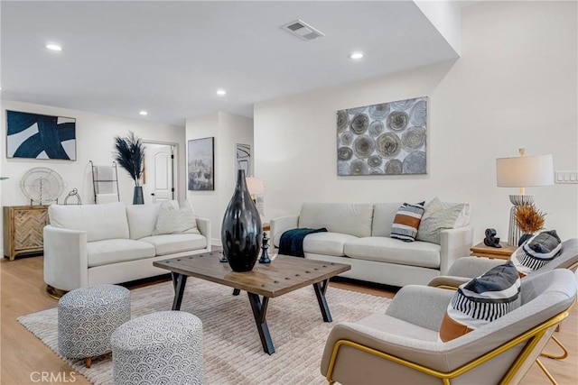 5621 E Carita St, Long Beach, CA 90808 - living area with light wood-style flooring and recessed lighting