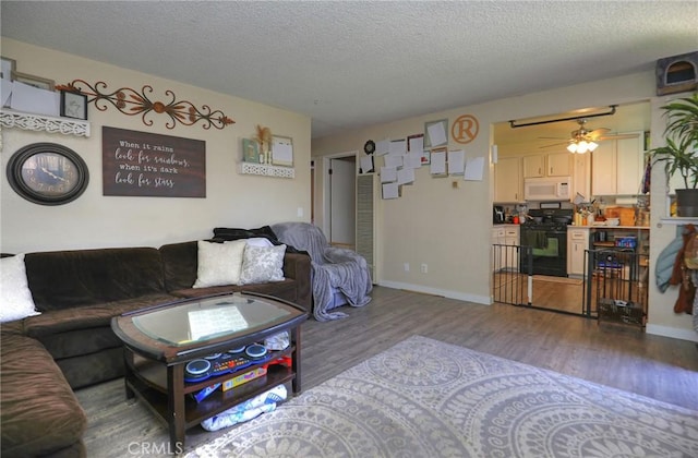 560 S 12th St, Grover Beach, CA 93433 - living room featuring wood finished floors, ceiling fan, and a textured ceiling