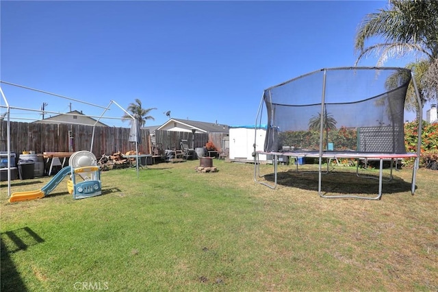 560 S 12th St, Grover Beach, CA 93433 - view of yard featuring a trampoline and a shed