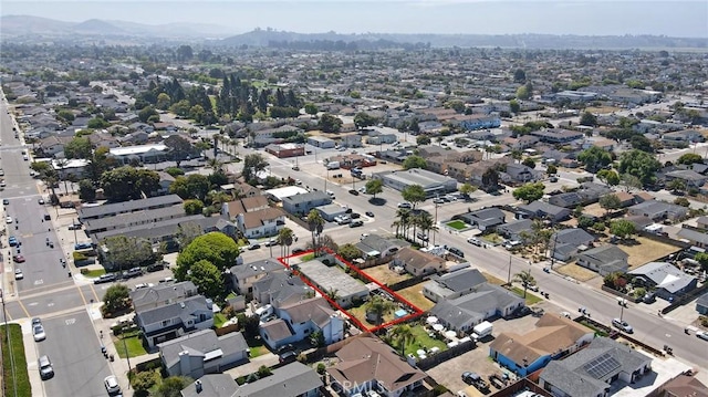 560 S 12th St, Grover Beach, CA 93433 - aerial view of property and surrounding area with property parcel outlined and nearby suburban area