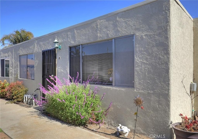 560 S 12th St, Grover Beach, CA 93433 - view of side of home featuring stucco siding
