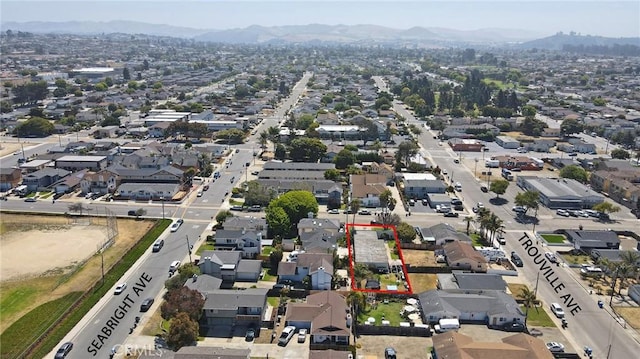 560 S 12th St, Grover Beach, CA 93433 - aerial view of residential area with mountains and property parcel outlined