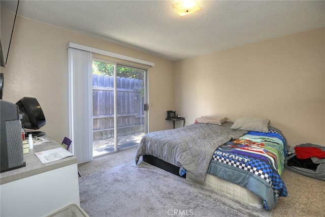 560 S 12th St, Grover Beach, CA 93433 - carpeted bedroom featuring access to exterior and a textured ceiling