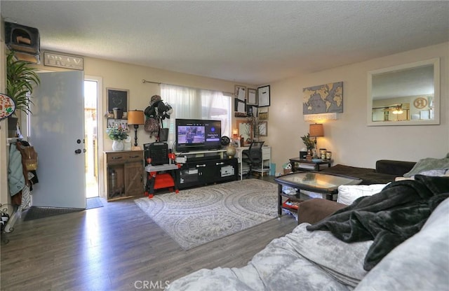 560 S 12th St, Grover Beach, CA 93433 - living area with wood finished floors and a textured ceiling