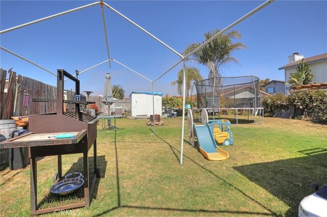 560 S 12th St, Grover Beach, CA 93433 - fenced backyard with a trampoline and a shed