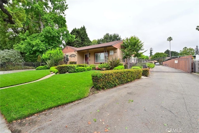 517 E Washington Blvd, Pasadena, CA 91104 - view of front facade with a gate, stucco siding, and asphalt driveway
