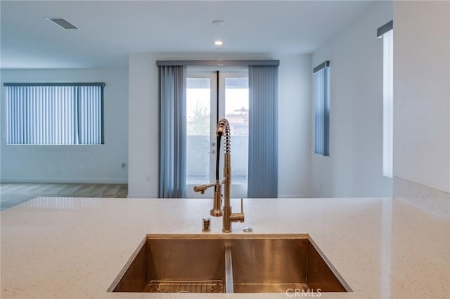 2823 Lily Ln, El Monte, CA 91733 - detailed view of light stone counters and recessed lighting