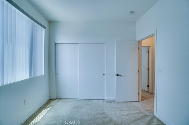 2823 Lily Ln, El Monte, CA 91733 - unfurnished bedroom with carpet floors, multiple windows, and a closet