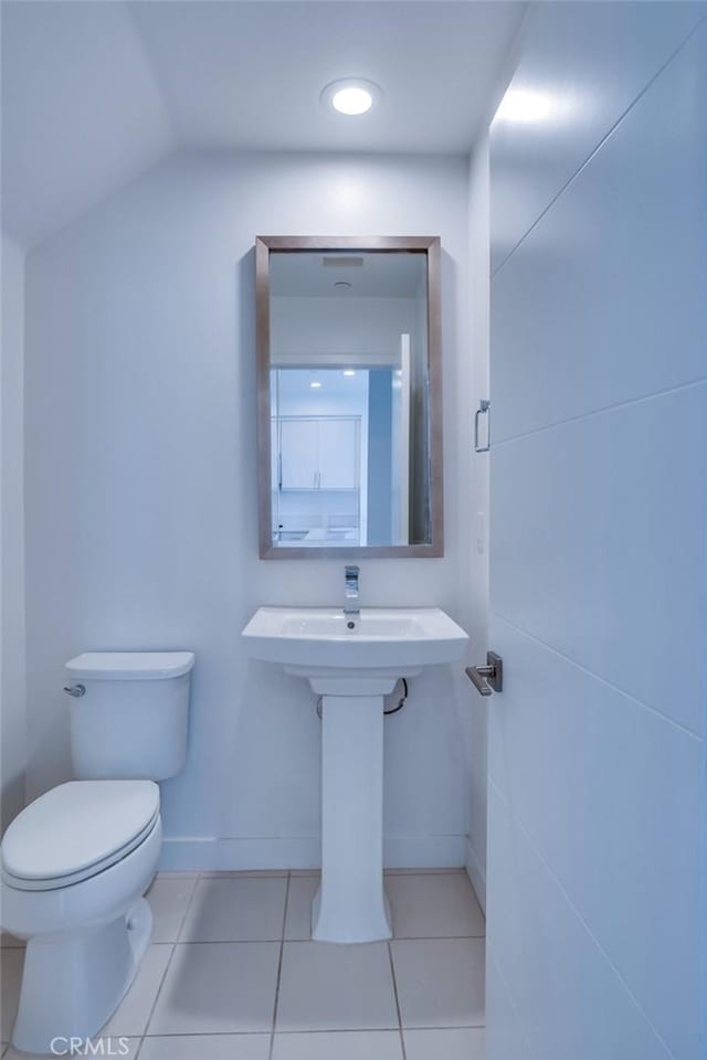 2823 Lily Ln, El Monte, CA 91733 - half bath featuring tile patterned floors and lofted ceiling