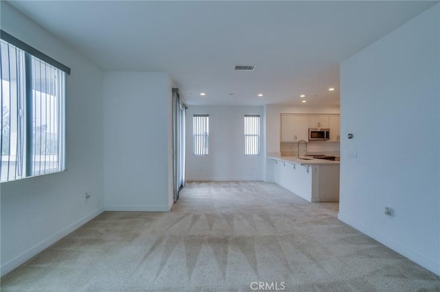 2823 Lily Ln, El Monte, CA 91733 - unfurnished living room with light carpet and recessed lighting