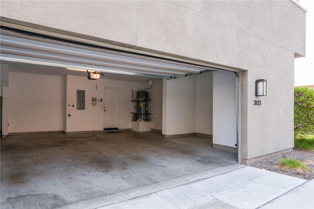 2823 Lily Ln, El Monte, CA 91733 - garage with a garage door opener and electric panel