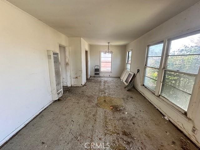 2616 E 220th Pl, Long Beach, CA 90810 - unfurnished room with a heating unit and a chandelier