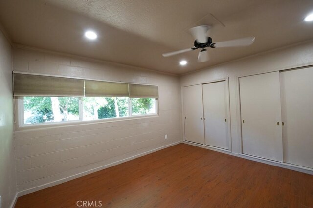 2158 N Ave, Chico, CA 95926 - unfurnished bedroom with wood finished floors, two closets, recessed lighting, and ceiling fan