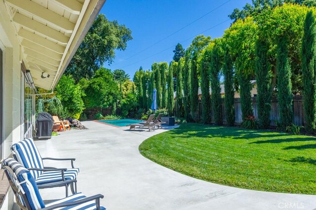 2158 N Ave, Chico, CA 95926 - fenced backyard with a patio area and view of scattered trees