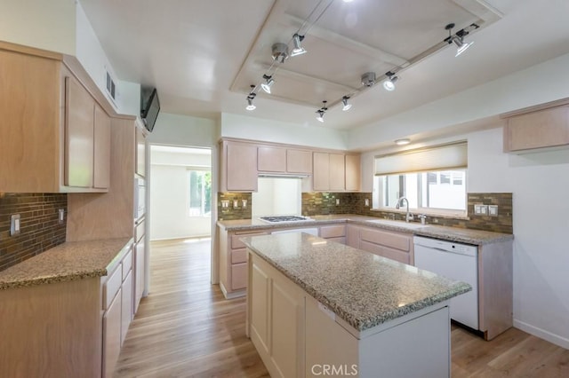 2158 N Ave, Chico, CA 95926 - kitchen featuring dishwasher, track lighting, tasteful backsplash, light brown cabinets, and light wood-type flooring